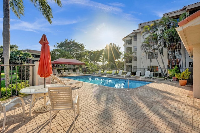 view of swimming pool with a gazebo and a patio