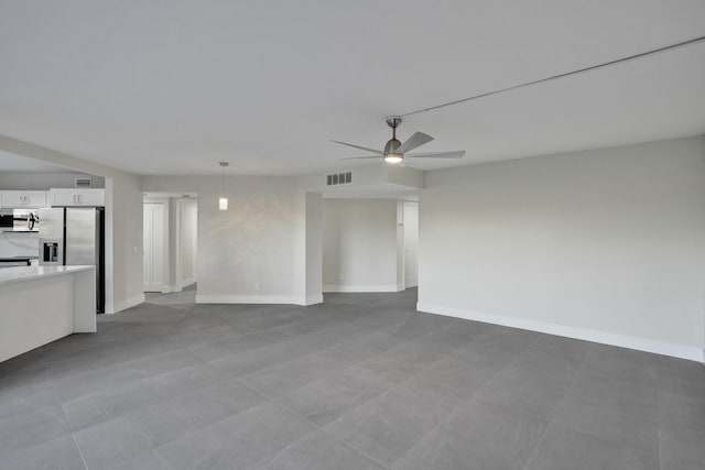 unfurnished living room featuring ceiling fan