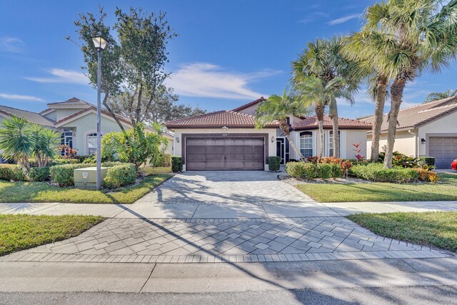 mediterranean / spanish-style home featuring a garage