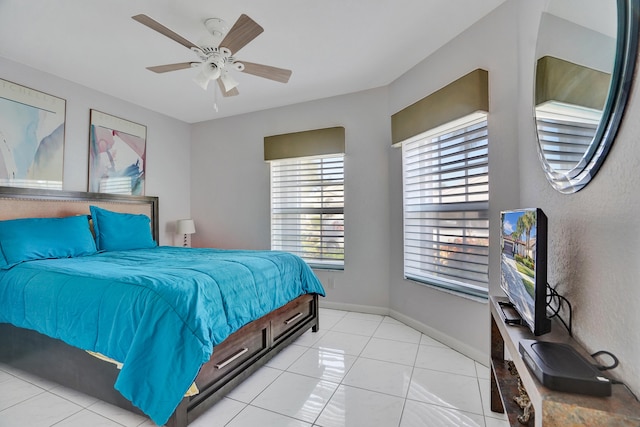 bedroom with light tile patterned floors and ceiling fan