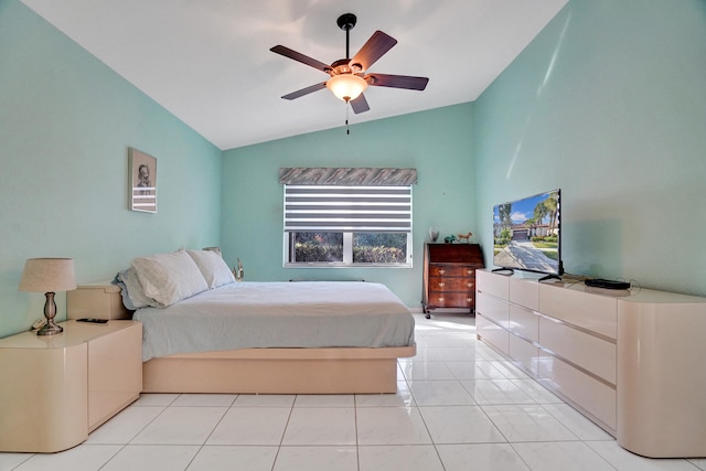 tiled bedroom featuring lofted ceiling and ceiling fan