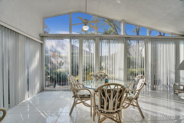 sunroom featuring lofted ceiling and ceiling fan