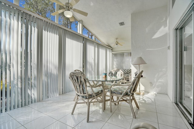 sunroom with lofted ceiling and ceiling fan