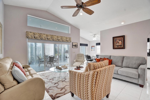 tiled living room with ceiling fan and vaulted ceiling