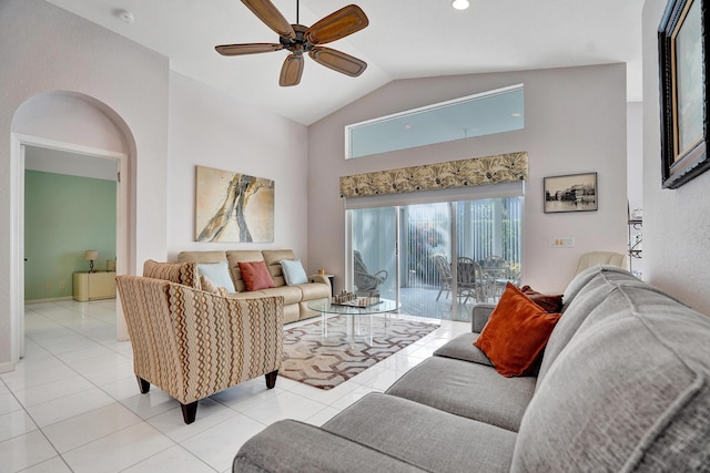 tiled living room featuring ceiling fan and high vaulted ceiling