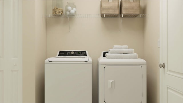 washroom with independent washer and dryer