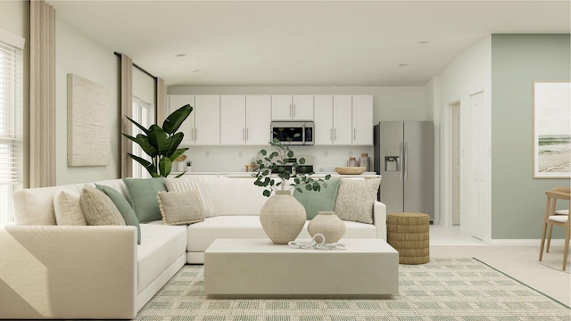 carpeted living room featuring a wealth of natural light