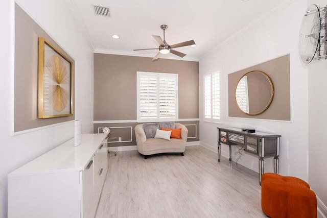 9895 SW Nuova Way, Port Saint Lucie, FL 34986 - sitting room with crown molding, ceiling fan, and light hardwood / wood-style flooring