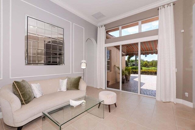 9895 SW Nuova Way, Port Saint Lucie, FL 34986 - tiled living room with crown molding