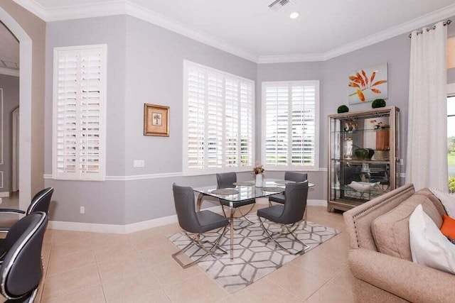 9895 SW Nuova Way, Port Saint Lucie, FL 34986 - tiled dining area featuring ornamental molding