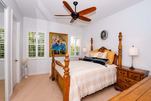 9895 SW Nuova Way, Port Saint Lucie, FL 34986 - carpeted bedroom with vaulted ceiling and ceiling fan