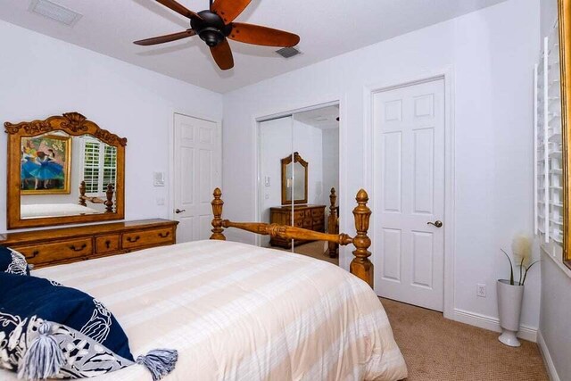9895 SW Nuova Way, Port Saint Lucie, FL 34986 - carpeted bedroom with ceiling fan and a closet