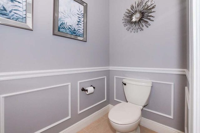 9895 SW Nuova Way, Port Saint Lucie, FL 34986 - bathroom featuring tile patterned flooring and toilet