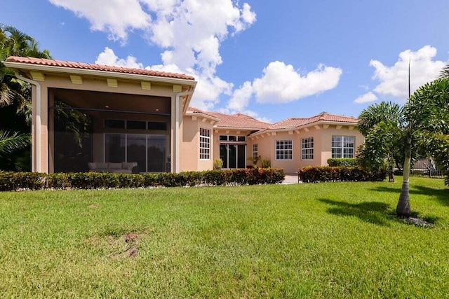 9895 SW Nuova Way, Port Saint Lucie, FL 34986 - back of house featuring a yard
