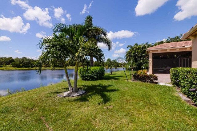 9895 SW Nuova Way, Port Saint Lucie, FL 34986 - view of yard featuring a water view