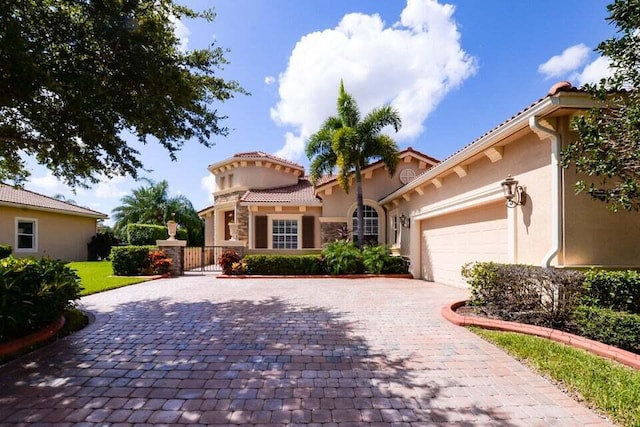 9895 SW Nuova Way, Port Saint Lucie, FL 34986 - mediterranean / spanish home featuring a garage
