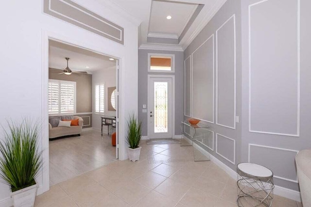 9895 SW Nuova Way, Port Saint Lucie, FL 34986 - tiled entrance foyer with crown molding and ceiling fan
