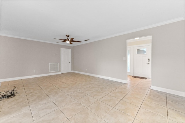 unfurnished room with ornamental molding and ceiling fan