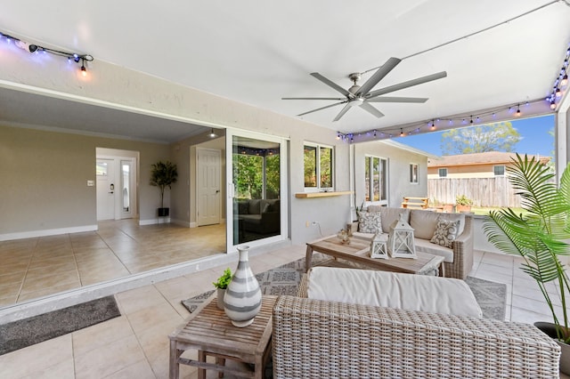view of patio with an outdoor hangout area, a ceiling fan, and fence