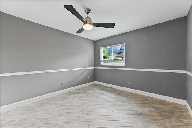 empty room featuring ceiling fan and light hardwood / wood-style floors