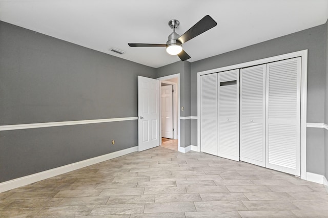 unfurnished bedroom featuring ceiling fan, a closet, and light hardwood / wood-style flooring