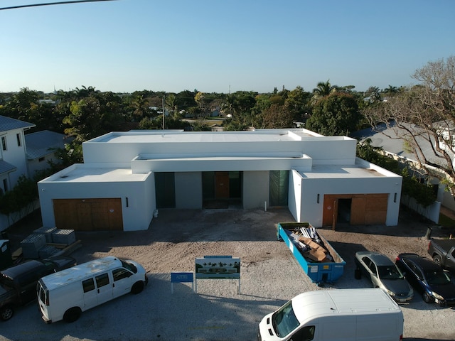 contemporary house with stucco siding