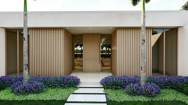 entrance to property featuring stucco siding