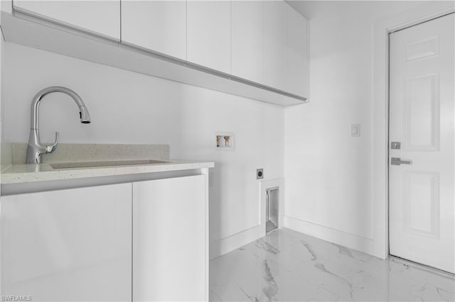 clothes washing area with cabinet space, baseboards, marble finish floor, hookup for an electric dryer, and washer hookup