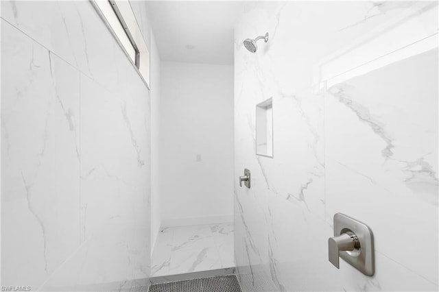 full bath with a marble finish shower