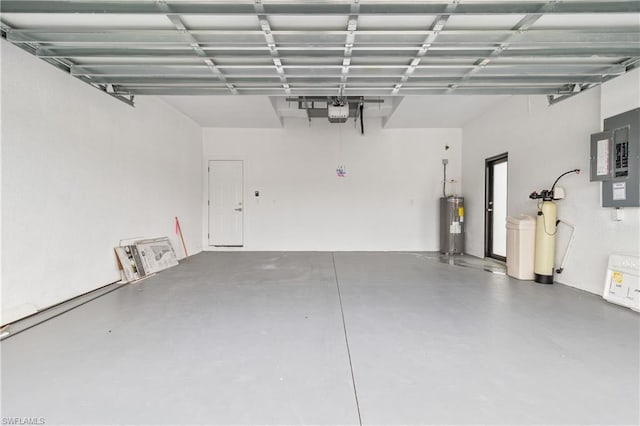 garage featuring water heater and electric panel