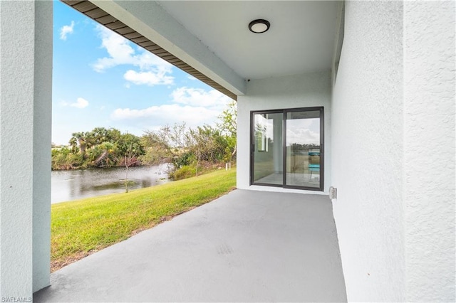 view of patio / terrace featuring a water view