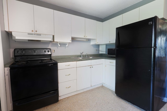 kitchen with under cabinet range hood, a sink, white cabinetry, black appliances, and dark countertops