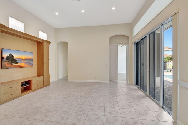 unfurnished living room featuring light tile patterned flooring