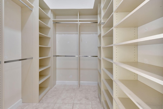 spacious closet featuring tile patterned floors