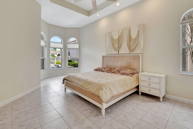 bedroom with light tile patterned floors, baseboards, and recessed lighting