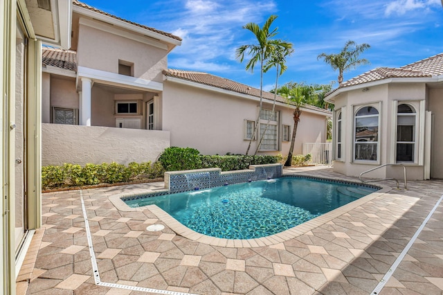 view of pool featuring a patio and pool water feature