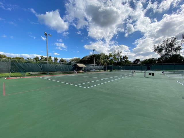 view of tennis court with fence