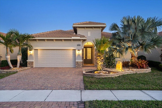 mediterranean / spanish house featuring a garage