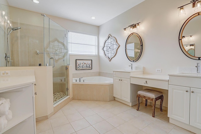 full bathroom with two vanities, a sink, a bath, and a shower stall