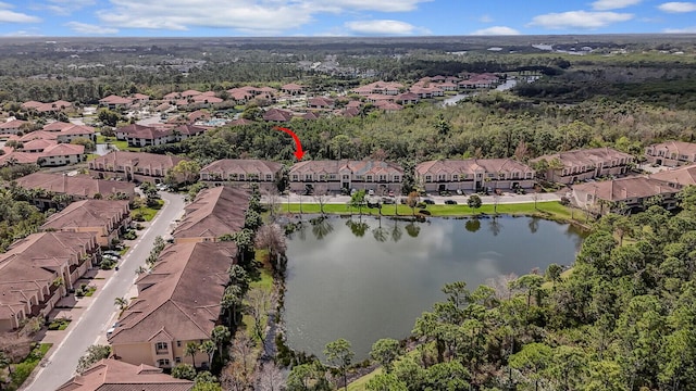 bird's eye view featuring a residential view and a water view