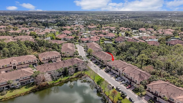 birds eye view of property with a residential view and a water view