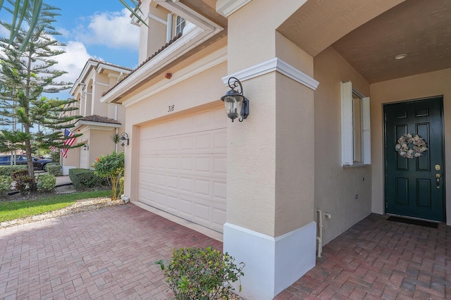 exterior space featuring decorative driveway