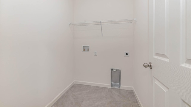 clothes washing area with hookup for a washing machine, electric dryer hookup, and light tile patterned floors