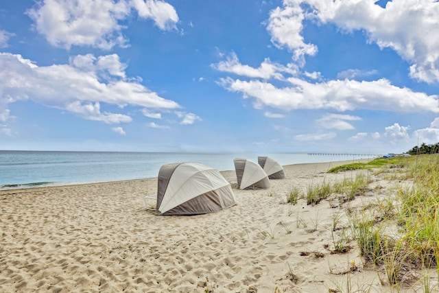 view of water feature with a beach view