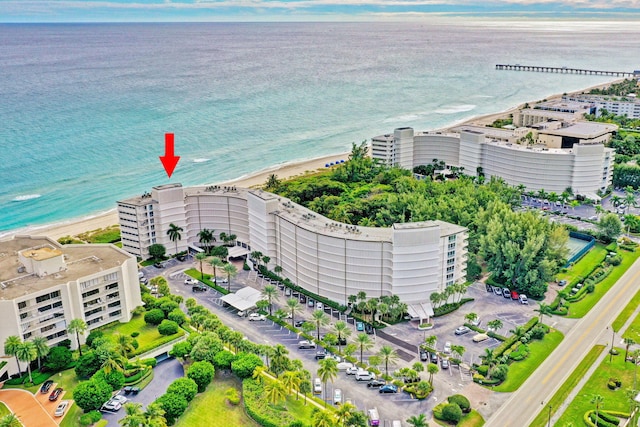 birds eye view of property featuring a water view and a view of the beach