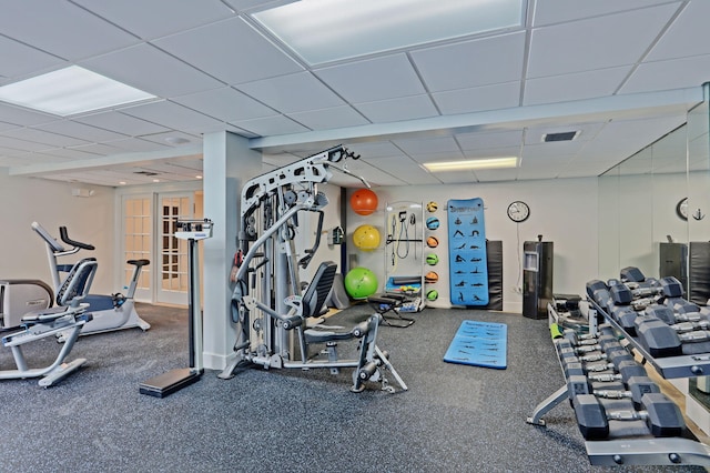 workout area featuring a drop ceiling