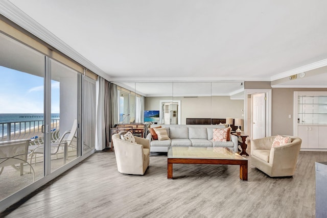 living room featuring crown molding, wood-type flooring, and a water view