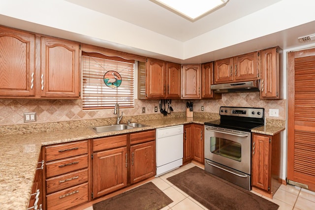 kitchen with dishwasher, stainless steel range with electric cooktop, a sink, under cabinet range hood, and light tile patterned flooring