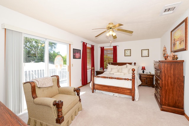 bedroom featuring access to exterior, light carpet, and a ceiling fan