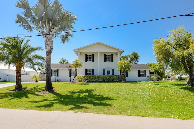 greek revival inspired property featuring stucco siding